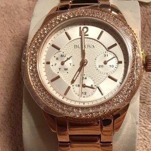 Women’s BULOVA rose gold watch.
